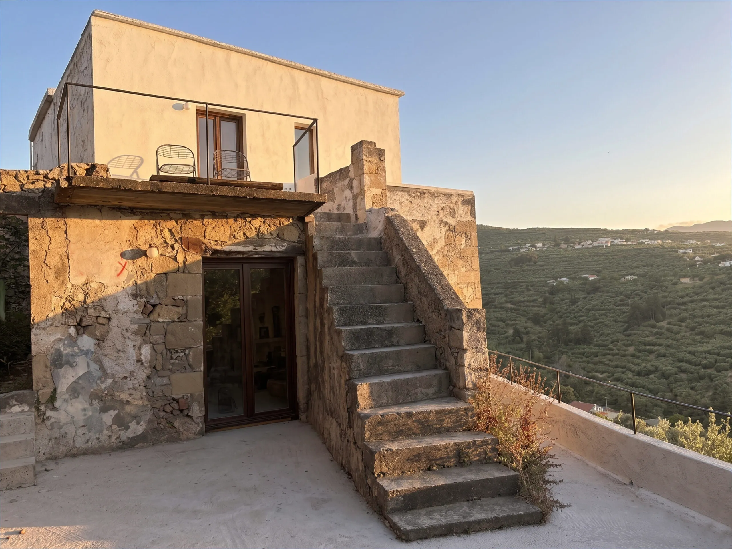 Historic stone architecture and terrace staircase at Anasa House