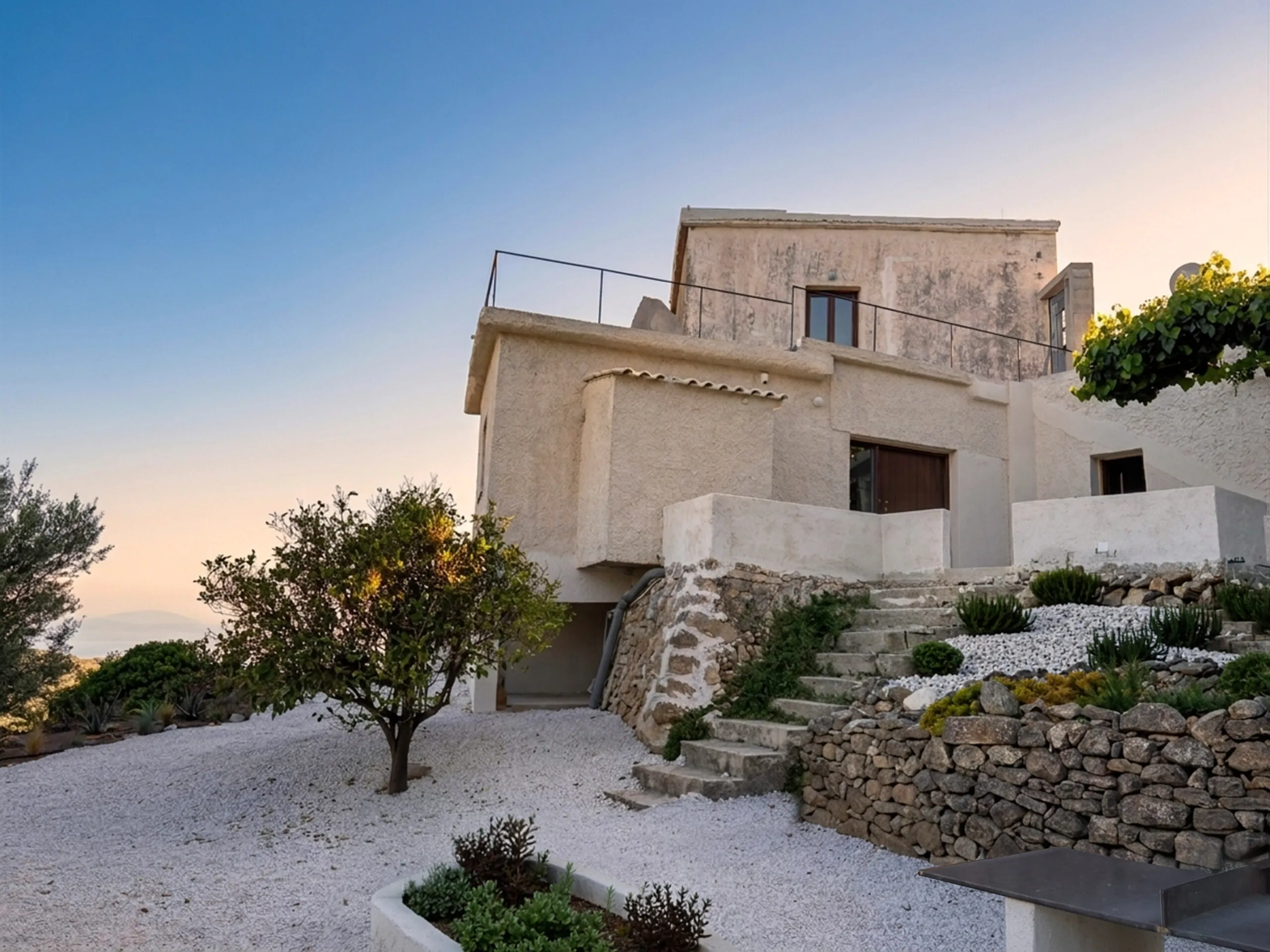 Exterior architecture of Anasa House with stone steps and Mediterranean landscaping