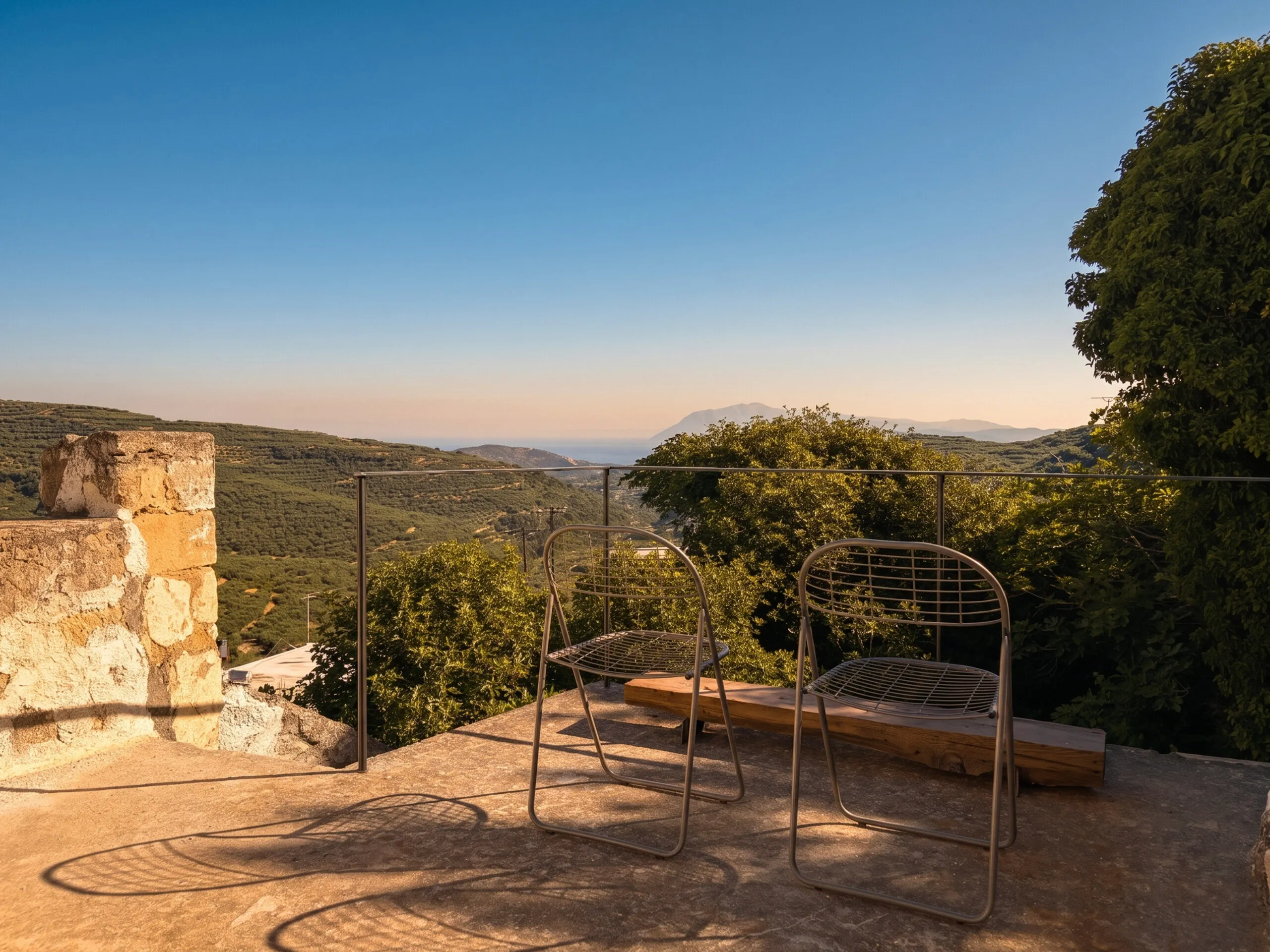 Outdoor relaxation area overlooking the hills of Crete at Anasa House